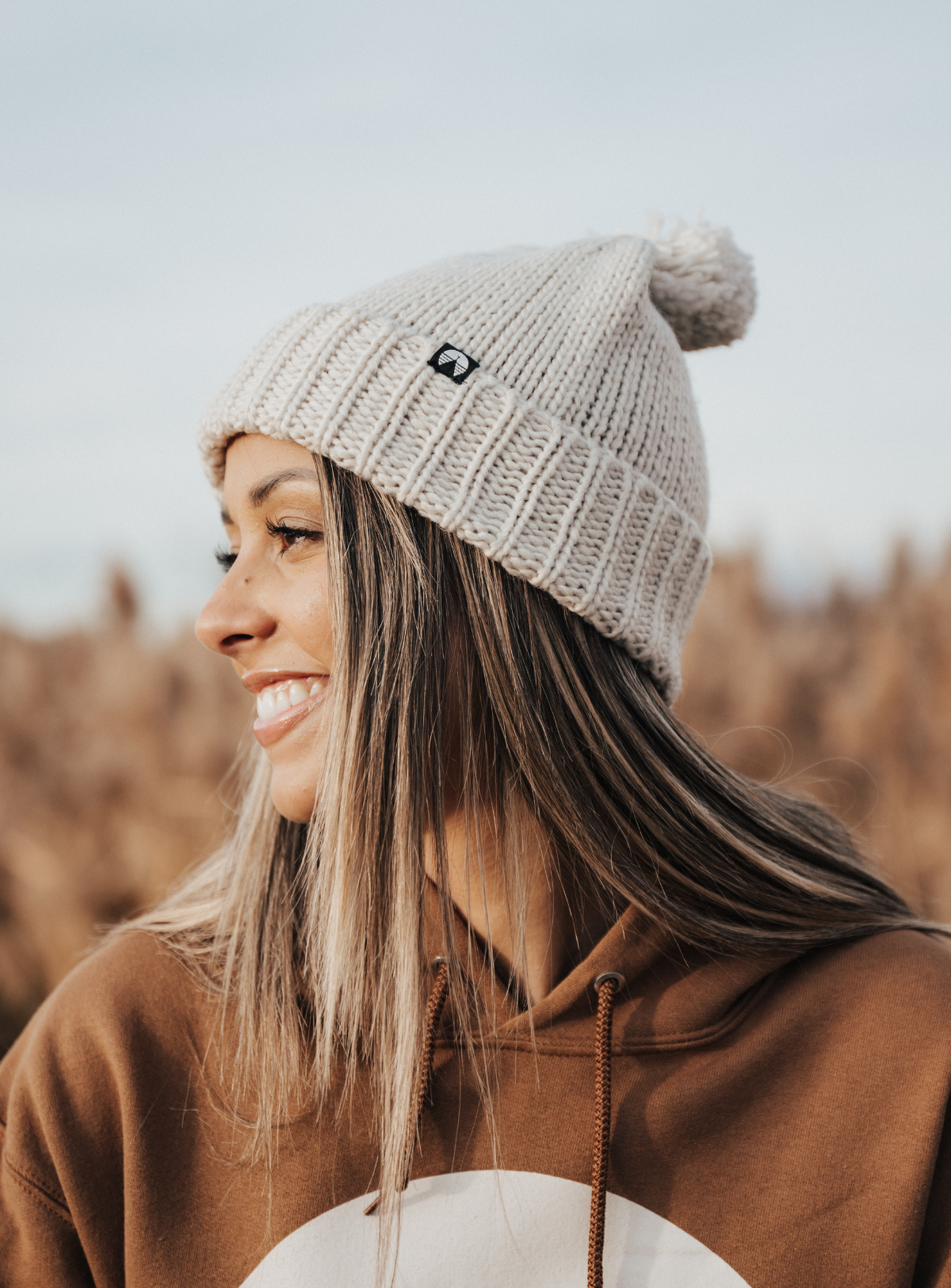 Creamy grey pom beanie